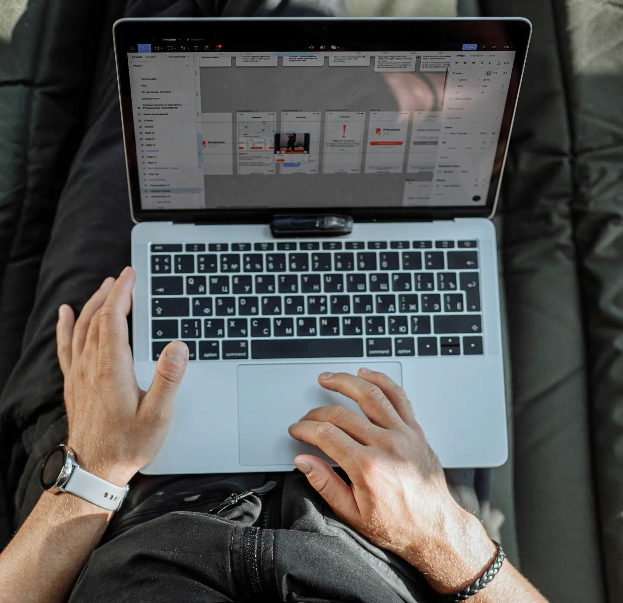 Professional working on cybersecurity with laptop and documents